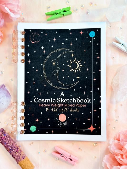 Handmade cosmic sketchbook with dark galaxy black cover and celestial design by Cosmic Charms