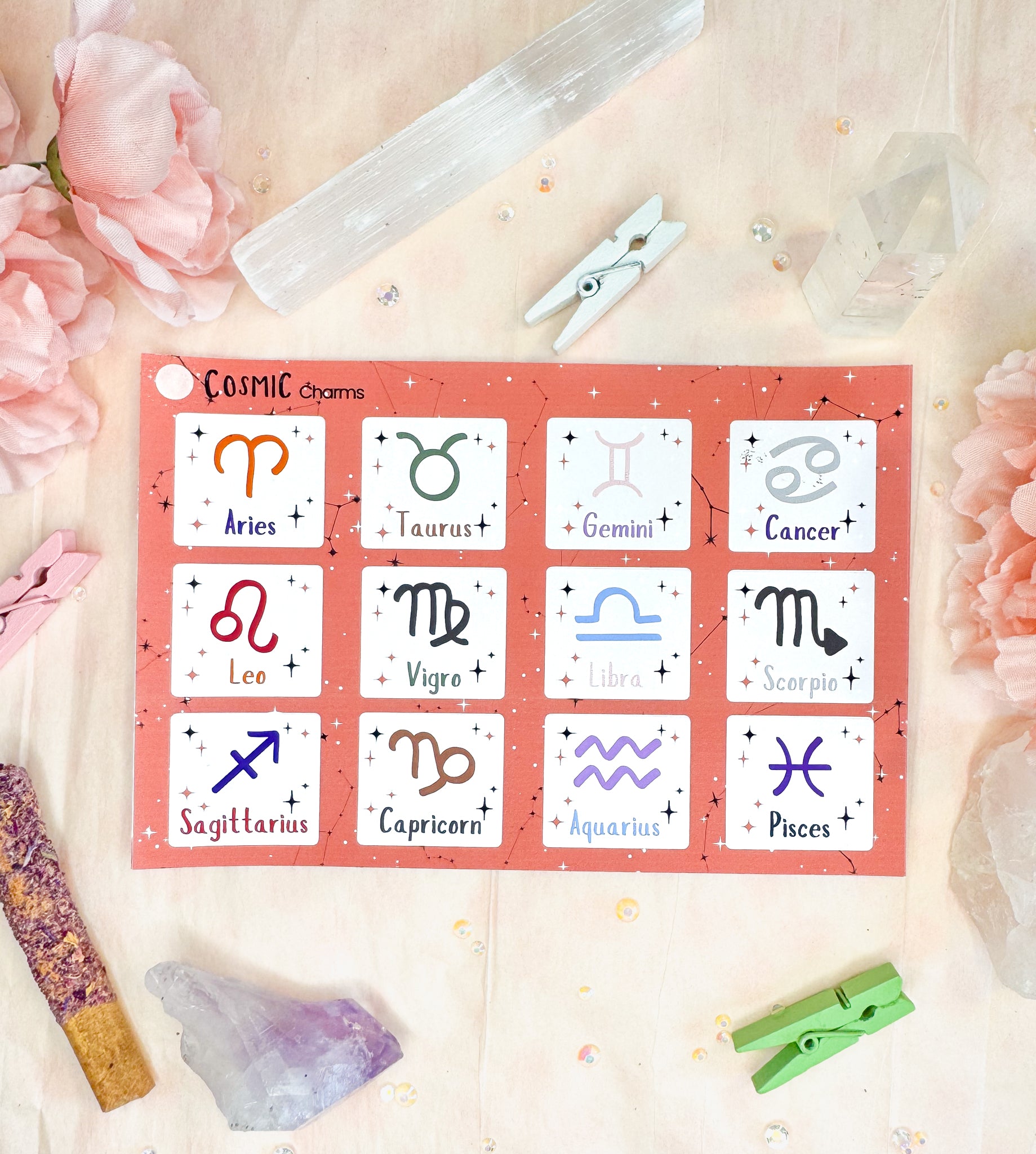 Zodiac sticker sheet showing matte finish options on a celestial background.